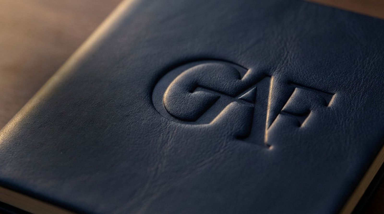 GAF logo debossed on textured leather notebook surface.