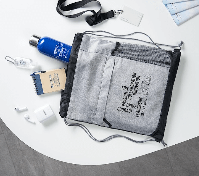 Amplifying Success: How Quest Tech Inc. Stole the Show with GiftAFeeling's Branded Merchandise