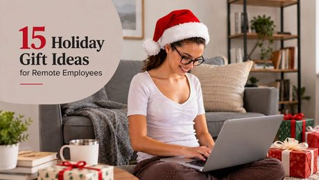 Smiling remote employee in a Santa hat working on a laptop at home, surrounded by wrapped holiday gifts.